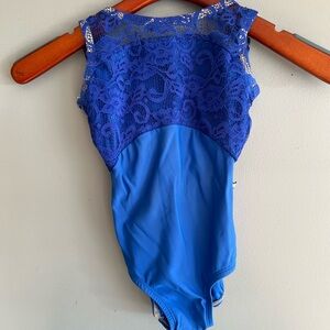 Beautiful sapphire blue Lucky Leo leotard with mesh top and solid bottom